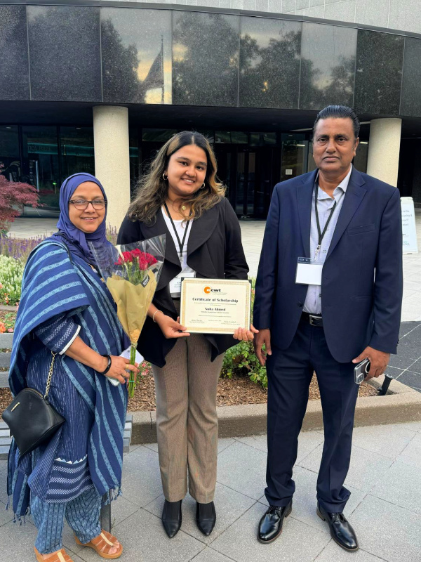 College of Engineering student Nuha Ahmed poses with her family after winning a scholarship award.